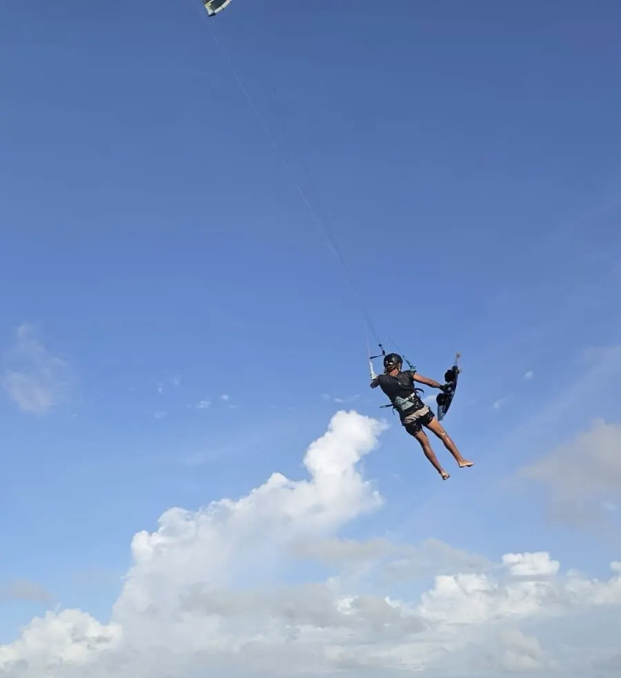 Kitesurfer jumping above the water